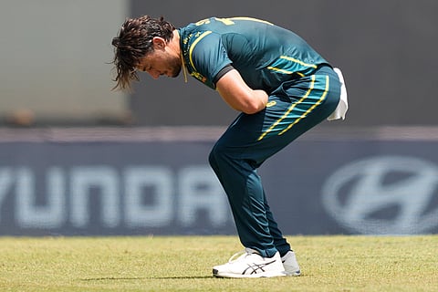 Australia's Marcus Stoinis reacts in pain after a ball hits on his hands during the T20 World Cup cricket match between Australia and Zimbabwe in Colombo, Sri Lanka.