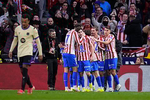 Atletico Madrid's team players celebrate after Ademola Lookman scored during the Copa del Rey semifinal first leg soccer match between Atletico Madrid and Barcelona in Madrid, Spain.