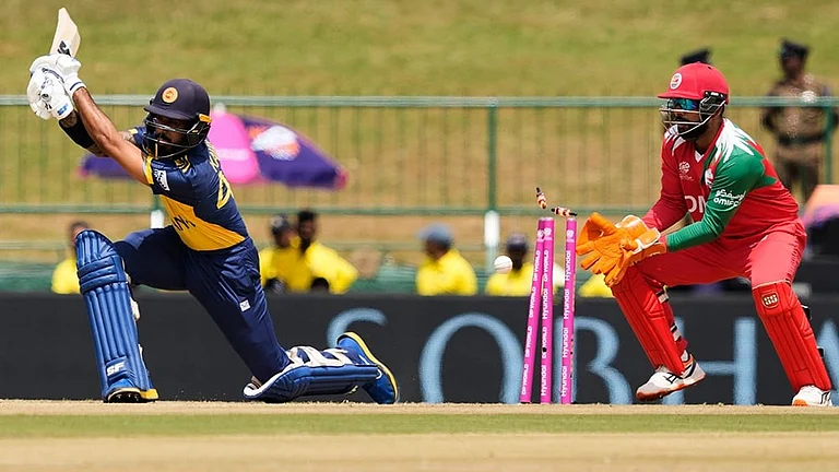 Sri Lanka's Kamil Mishara bowled out by Oman's Jay Odedra during the T20 World Cup cricket match between Oman and Sri Lanka in Pallekele, Sri Lanka. - | Photo: AP/Eranga Jayawardena