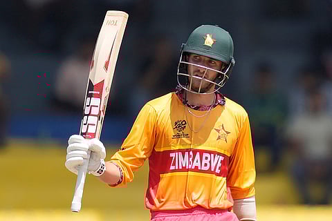 Zimbabwe's Brian Bennett celebrates his fifty runs during the T20 World Cup cricket match between Australia and Zimbabwe in Colombo, Sri Lanka.