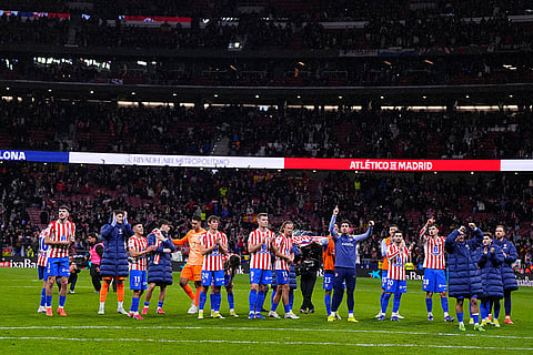 Atletico Madrid's team players celebrate after the Copa del Rey semifinal first leg soccer match between Atletico Madrid and Barcelona in Madrid, Spain.