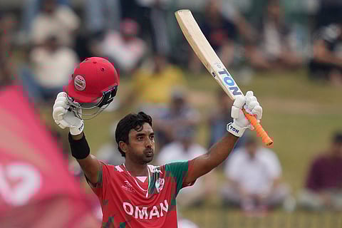 Oman's Syed Aamir Kaleem celebrates his fifty runs during the T20 World Cup cricket match between Ireland and Oman in Colombo, Sri Lanka.