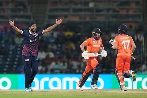 United States' Harmeet Singh, left, appeals successfully for the wicket of Netherlands' Roelof van der Merwe, second from right, during the T20 World Cup cricket match between Netherlands and United States in Chennai, India.