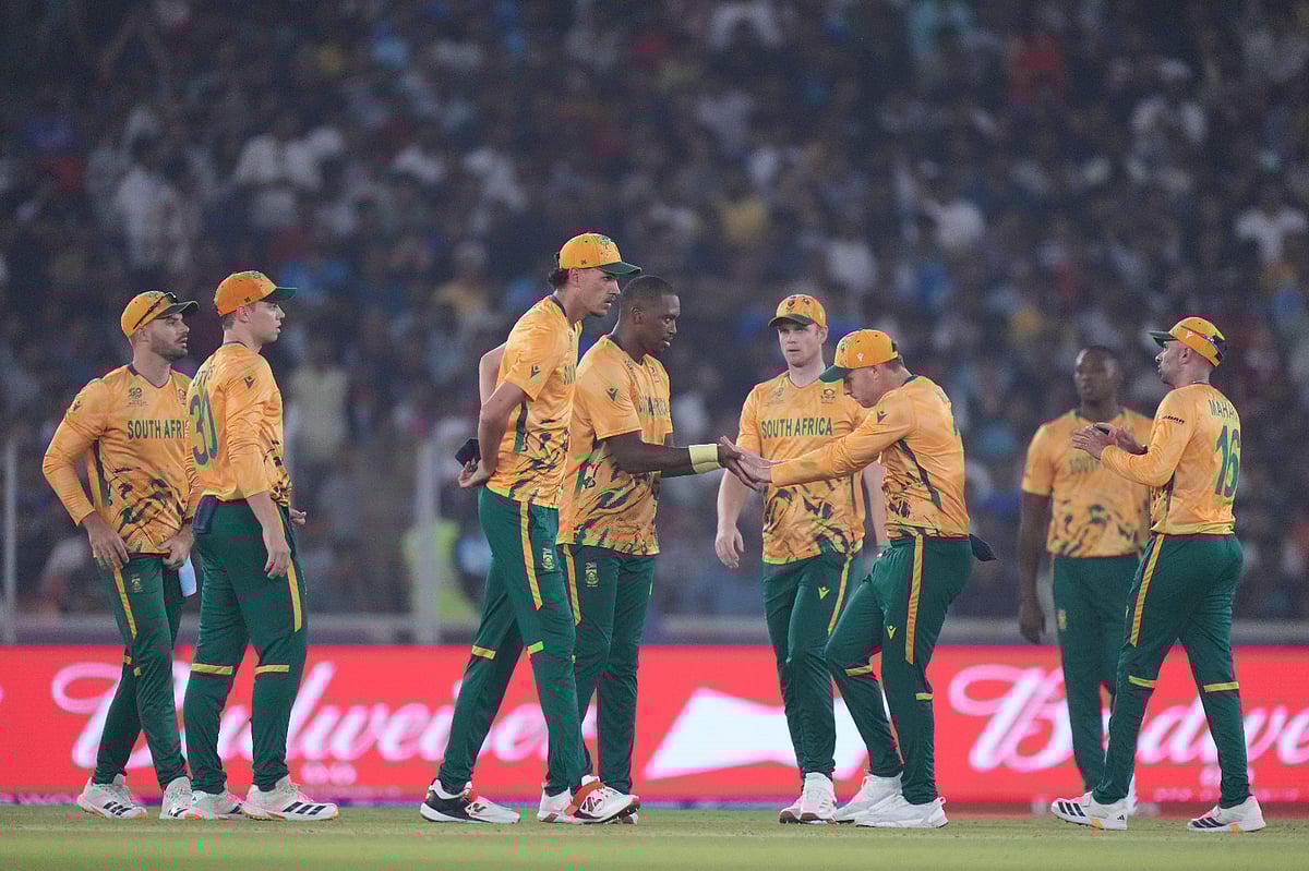 South Africa's Lungi Ngidi, celebrates with teammates the wicket of New Zealand's Daryl Mitchell during the ICC T20 World Cup 2026 cricket group B match between South Africa and New Zealand in Ahmedabad.