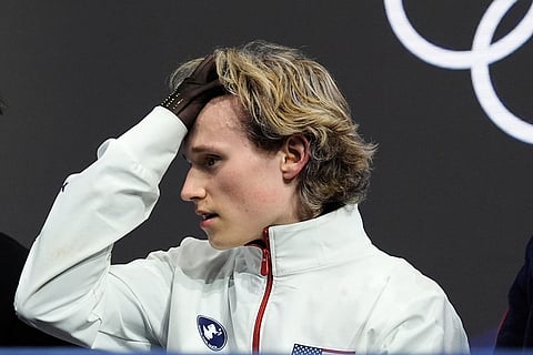 Ilia Malinin of the United States reacts after competing while waiting for scores during the men's free skate program in figure skating at the 2026 Winter Olympics, in Milan, Italy.