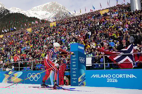 Silver medalist Vetle Sjaastad Christiansen, of Norway, crosses the finish line during the men's 10-kilometer sprint biathlon race at the 2026 Winter Olympics in Anterselva, Italy.