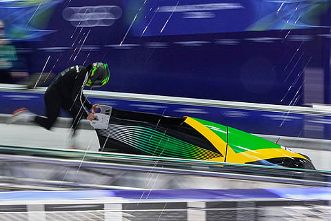 Jamaica's Mica Moore starts for a women's monobob training session at the 2026 Winter Olympics, in Cortina d'Ampezzo, Italy.