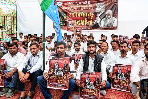 National Students' Union of India’s (NSUI) Rajasthan President Vinod Jakhar, third right, and others stage a dharna during a symbolic protest over the alleged 'Epstein Files' row and against Prime Minister Narendra Modi, at Shaheed Smarak, in Jaipur.