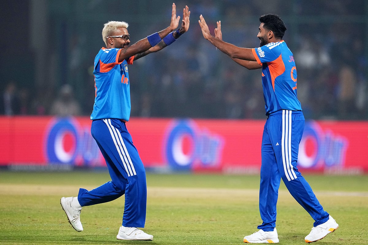 India's Hardik Pandya and Jasprit Bumrah celebrate the wicket of Namibia's Ruben Trumpelmann during the T20 World Cup cricket match between India and Namibia in New Delhi, India, Thursday, Feb. 12, 2026. - | Photo: AP/Manish Swarup