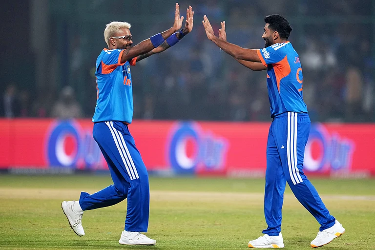 India's Hardik Pandya and Jasprit Bumrah celebrate the wicket of Namibia's Ruben Trumpelmann during the T20 World Cup cricket match between India and Namibia in New Delhi, India, Thursday, Feb. 12, 2026. - | Photo: AP/Manish Swarup