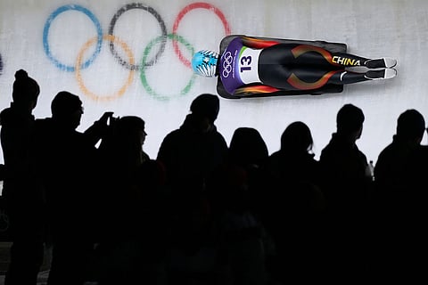 China's Zhao Dan slides down the track during a women's skeleton run at the 2026 Winter Olympics, in Cortina d'Ampezzo, Italy.