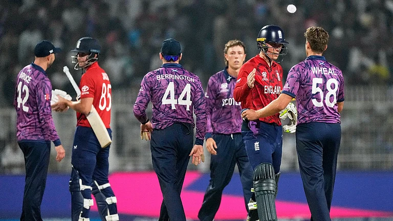 England's Will Jacks, second left, and batting partner Tom Banton, shake hands with Scotland's Tom Bruce and Bradley Wheal respectively after England won the ICC T20 World Cup 2026 Group C cricket match against Scotland in Kolkata. - AP Photo