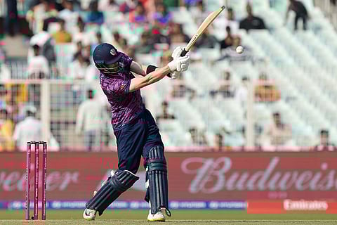 Scotland's Michael Jones plays a shot during the T20 World Cup cricket match between England and Scotland in Kolkata, India.