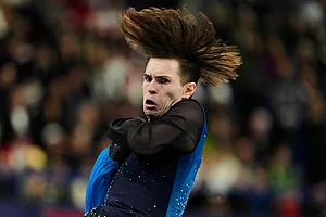 | Photo: AP/Natacha Pisarenko : Mikhail Shaidorov of Kazakhstan competes during the men's free skate program in figure skating at the 2026 Winter Olympics, in Milan, Italy.