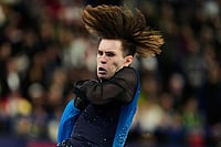 | Photo: AP/Natacha Pisarenko : Mikhail Shaidorov of Kazakhstan competes during the men's free skate program in figure skating at the 2026 Winter Olympics, in Milan, Italy.