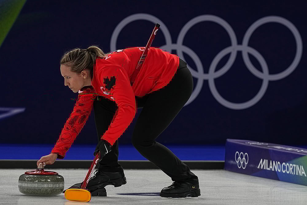 Canada's Rachel Homan in action during the women's curling round robin session against Switzerland at the 2026 Winter Olympics, in Cortina d'Ampezzo, Italy. - | Photo: AP/Fatima Shbair