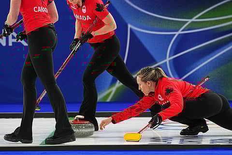 Canada's Rachel Homan in action during the women's curling round robin session against Switzerland at the 2026 Winter Olympics, in Cortina d'Ampezzo, Italy.