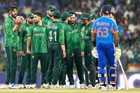 Pakistan's players wait for the third umpire's decision for the wicket of India's captain Suryakumar Yadav, right, during the T20 World Cup cricket match between India and Pakistan in Colombo, Sri Lanka.