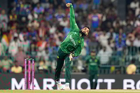 Pakistan's Shadab Khan bowls a delivery during the T20 World Cup cricket match between India and Pakistan in Colombo, Sri Lanka.