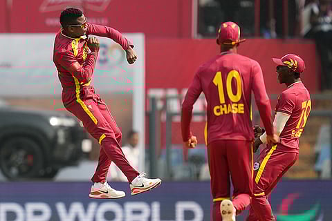 West Indies' Akeal Hosein celebrates the wicket of Nepal's Kushal Bhurtel during the T20 World Cup cricket match between Nepal and West Indies in Mumbai.
