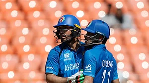ACBofficials/X : Afghanistan cricketers in action against South Africa in ICC T20 World Cup 2026 Group D match.