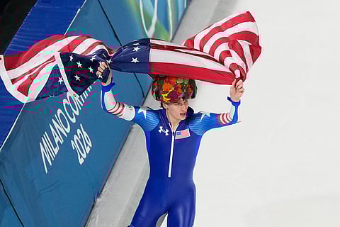 United States' Jordan Stolz celebrates after winning gold and setting a new Olympic record in the men's 500-meters speedskating final at the 2026 Winter Olympics, in Milan, Italy.