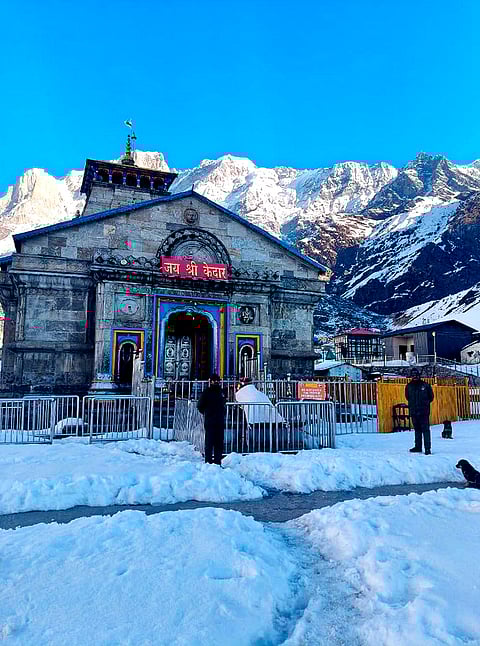 Security personnel stand guard at the snow-laden Kedarnath Temple complex, in Rudraprayag district, Uttarakhand. The portals of the revered temple in the Garhwal Himalayas of Uttarakhand will reopen for devotees on April 22 after remaining closed for nearly six months during winter, a temple committee official said on Sunday. 