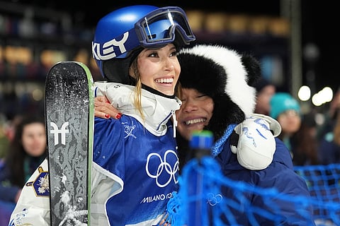 China's Eileen Gu, left, gets a hug from her mother Yan Gu as she competes in the women's freestyle skiing big air qualifications at the 2026 Winter Olympics, in Livigno, Italy.