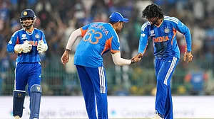 Eranga Jayawardena : Tilak Varma, right, and captain Suryakumar Yadav celebrate the wicket of Shadab Khan during the T20 World Cup match between India and Pakistan in Colombo, Sri Lanka.