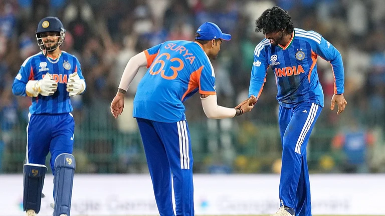 Tilak Varma, right, and captain Suryakumar Yadav celebrate the wicket of Shadab Khan during the T20 World Cup match between India and Pakistan in Colombo, Sri Lanka. - Eranga Jayawardena