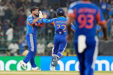India's Kuldeep Yadav, left, celebrates with teammate Ishan Kishan the wicket of Pakistan's Mohammad Nawaz during the T20 World Cup cricket match between India and Pakistan in Colombo, Sri Lanka.