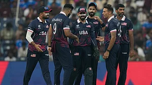Photo: AP : United States' Shadley Van Schalkwyk, second right, celebrates with teammates the wicket of Namibia's captain Gerhard Erasmus during their T20 World Cup cricket match in Chennai.