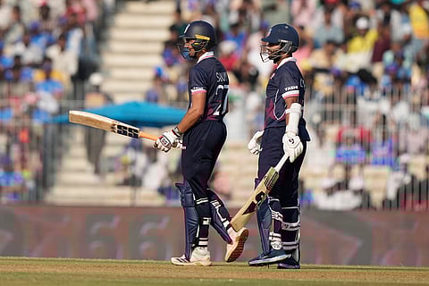 United States' Sanjay Krishnamurthi, left, celebrates his fifty runs during the T20 World Cup cricket match between Namibia and USA in Chennai.