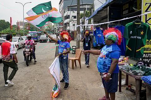 A vendor sells national flags of India and Pakistan, before an ICC Men's T20 World Cup 2026 cricket match between India and Pakistan, near R Premadasa Stadium, in Colombo, Sri Lanka.