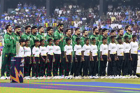 Pakistan's players stand up for the national anthems before the start of the T20 World Cup cricket match between India and Pakistan in Colombo, Sri Lanka.