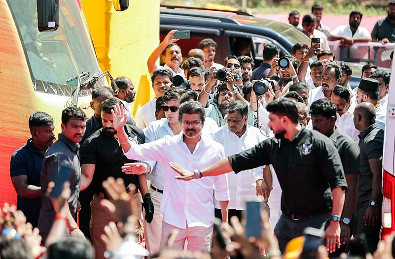 Tamilaga Vettri Kazhagam (TVK) President Vijay waves as he arrives for the public meeting