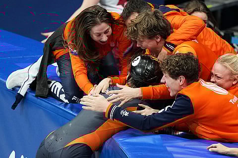 Gold medalist Jens van 't Wout of the Netherlands celebrates after the short track speed skating men's 1500m final at the 2026 Winter Olympics, in Milan, Italy.