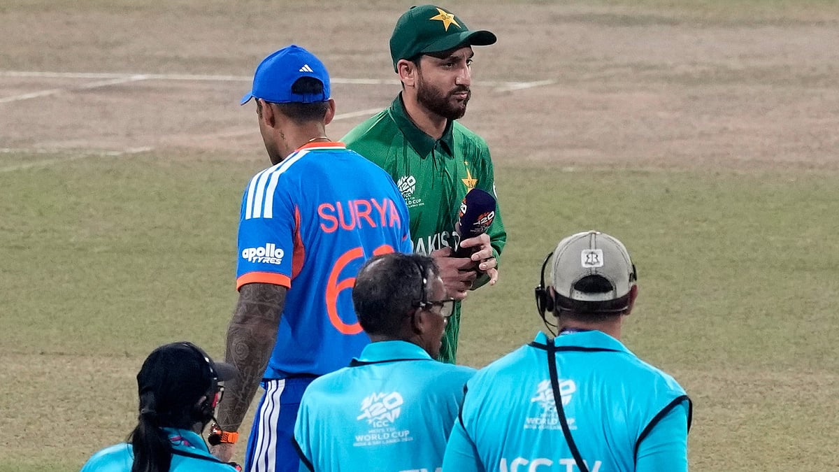 India's captain Suryakumar Yadav, left, and Pakistan's captain Salman Ali Agha walk past each other after the coin toss of the T20 World Cup cricket match between India and Pakistan in Colombo, Sri Lanka, Sunday, Feb. 15, 2026 - (AP Photo/Eranga Jayawardena)