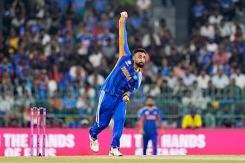 India's Varun Chakravarthy bowls a delivery during the T20 World Cup cricket match between India and Pakistan in Colombo, Sri Lanka.