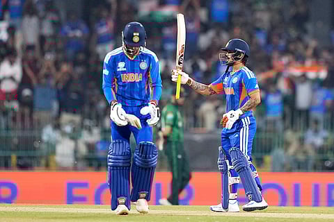 India's Ishan Kishan, right, celebrates his fifty runs as batting partner Tilak Varma looks on during the T20 World Cup cricket match between India and Pakistan in Colombo, Sri Lanka.