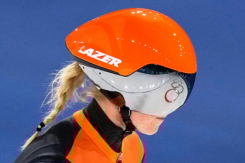 The Olympic Rings are reflected in the helmet of Marijke Groenewoud of the Netherlands after the women's team pursuit quarterfinals speedskating race at the 2026 Winter Olympics, in Milan, Italy.