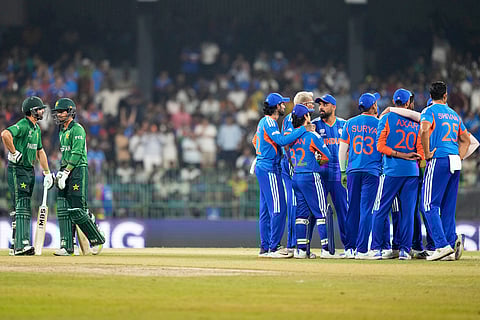 India's players wait for the third umpire's decision for the wicket of Pakistan's Saim Ayub, second left, during the T20 World Cup cricket match between India and Pakistan in Colombo, Sri Lanka.