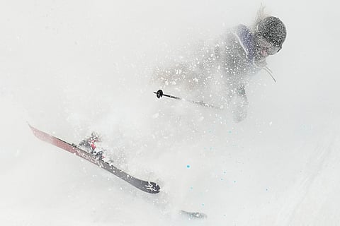 Switzerland's Sarah Hoefflin lands as she competes in the women's freestyle skiing big air qualifications at the 2026 Winter Olympics, in Livigno, Italy.