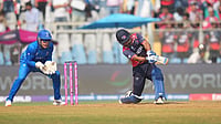 | Photo: AP/Rafiq Maqbool : Nepal's captain Rohit Paudel plays a shot during the T20 World Cup cricket match between Italy and Nepal in Mumbai, India.