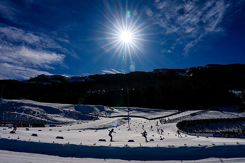 Athletes compete in the cross country skiing men's 4 x 7.5km relay at the 2026 Winter Olympics, in Tesero, Italy.
