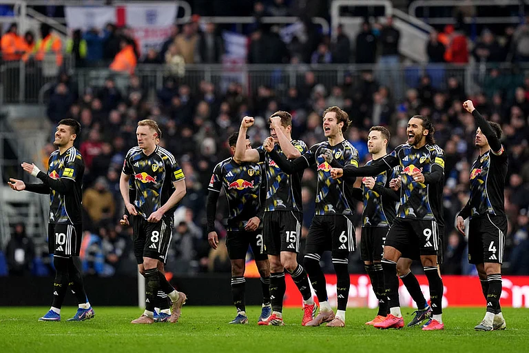 Leeds United players celebrate after winning the penalty shoot out at the end of the Emirates FA Cup fourth round match between Leeds United and Bimingham City, in Birmingham, England. - | Photo: Jacob King/PA via AP