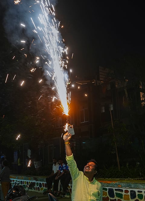 Fans burst firecrackers as they celebrate India's victory over Pakistan in an ICC Men's T20 World Cup 2026 cricket match at Shivaji Park, in Mumbai, Maharashtra.