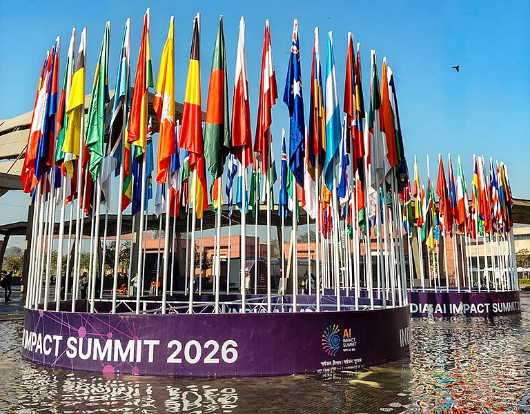 National flags of various countries at Bharat Mandapam during the India AI Impact Summit 2026, in New Delhi. - | Photo: PTI