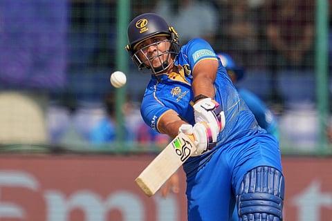 United Arab Emirates' Alishan Sharafu hits a six during the T20 World Cup cricket match between Afghanistan and United Arab Emirates in New Delhi.