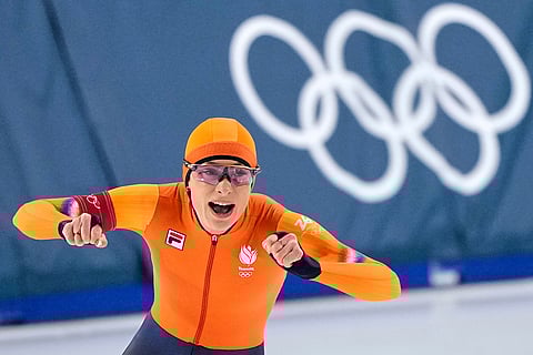 Femke Kok of the Netherlands celebrates winning the gold medal in the women's 500 meters speedskating race at the 2026 Winter Olympics, in Milan, Italy.